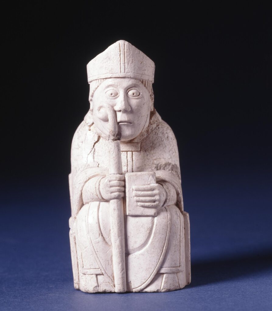 Chess piece; bishop holding crozier and book