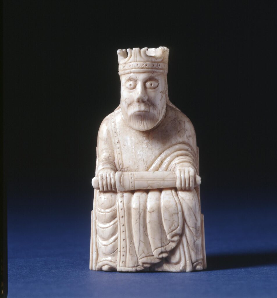 Chess piece; king with sword across lap