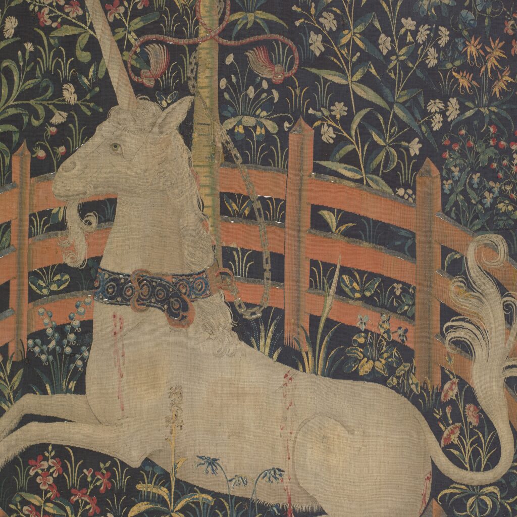 This image is a close-up of the Unicorn Rests in a Garden tapestry. It is included as an example of the intricate details found throughout medieval tapestries.