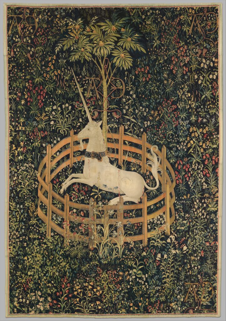 This image depicts the Unicorn Rests in a Garden Tapestry, one of the examples of medieval tapestries I reference throughout the article.