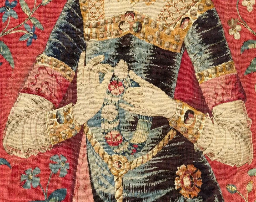 This image depicts a section of one of the Lady and the Unicorn tapestries. It is included as an example of the intricate details characteristic of medieval tapestries.