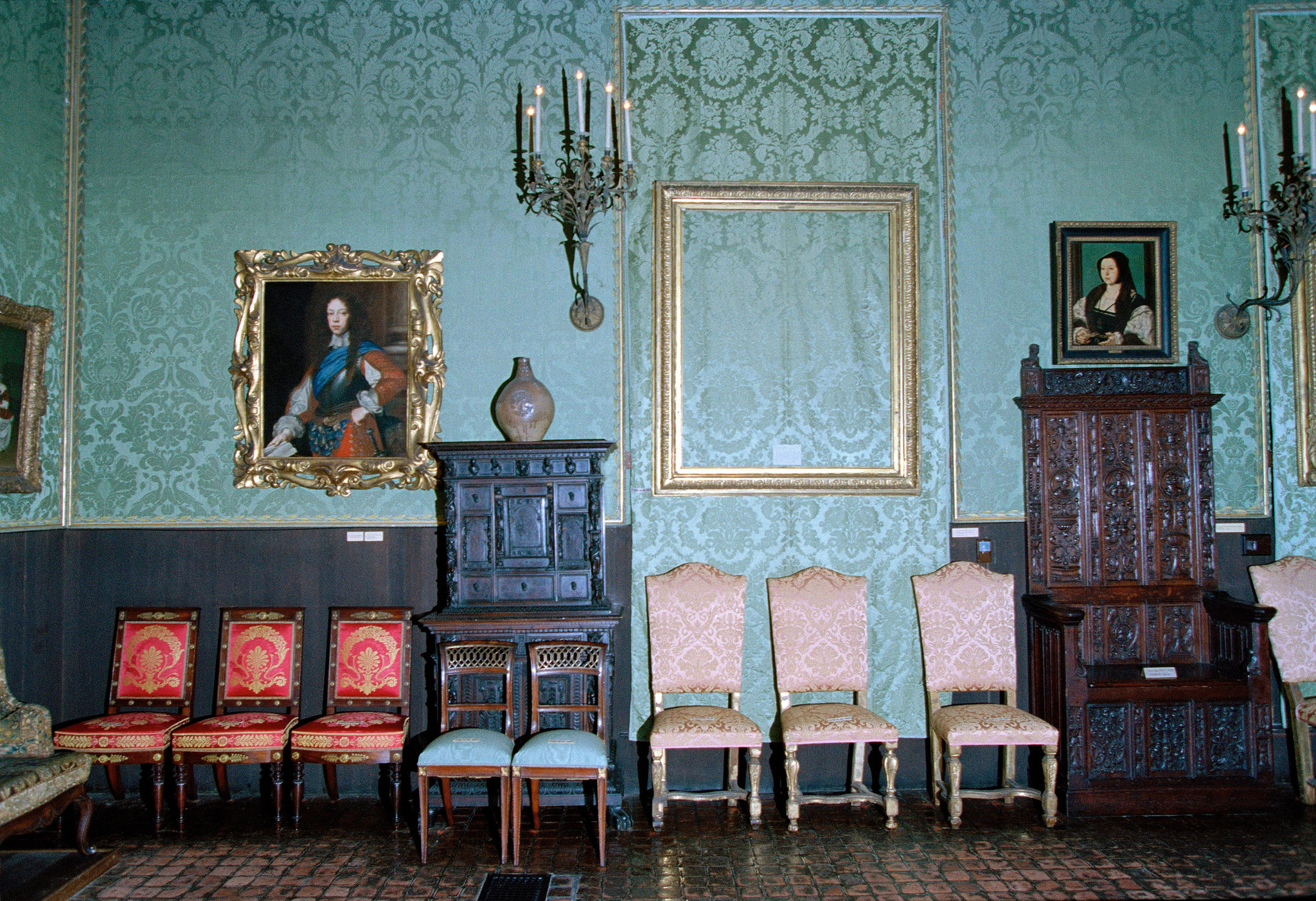 This photograph from the Isabella Stewart Gardner Museum depicts an empty frame in the gallery where Rembrandt’s “Storm” had been displayed. Because they are not allowed to change the exhibits, this empty frame represents the piece that was stolen.