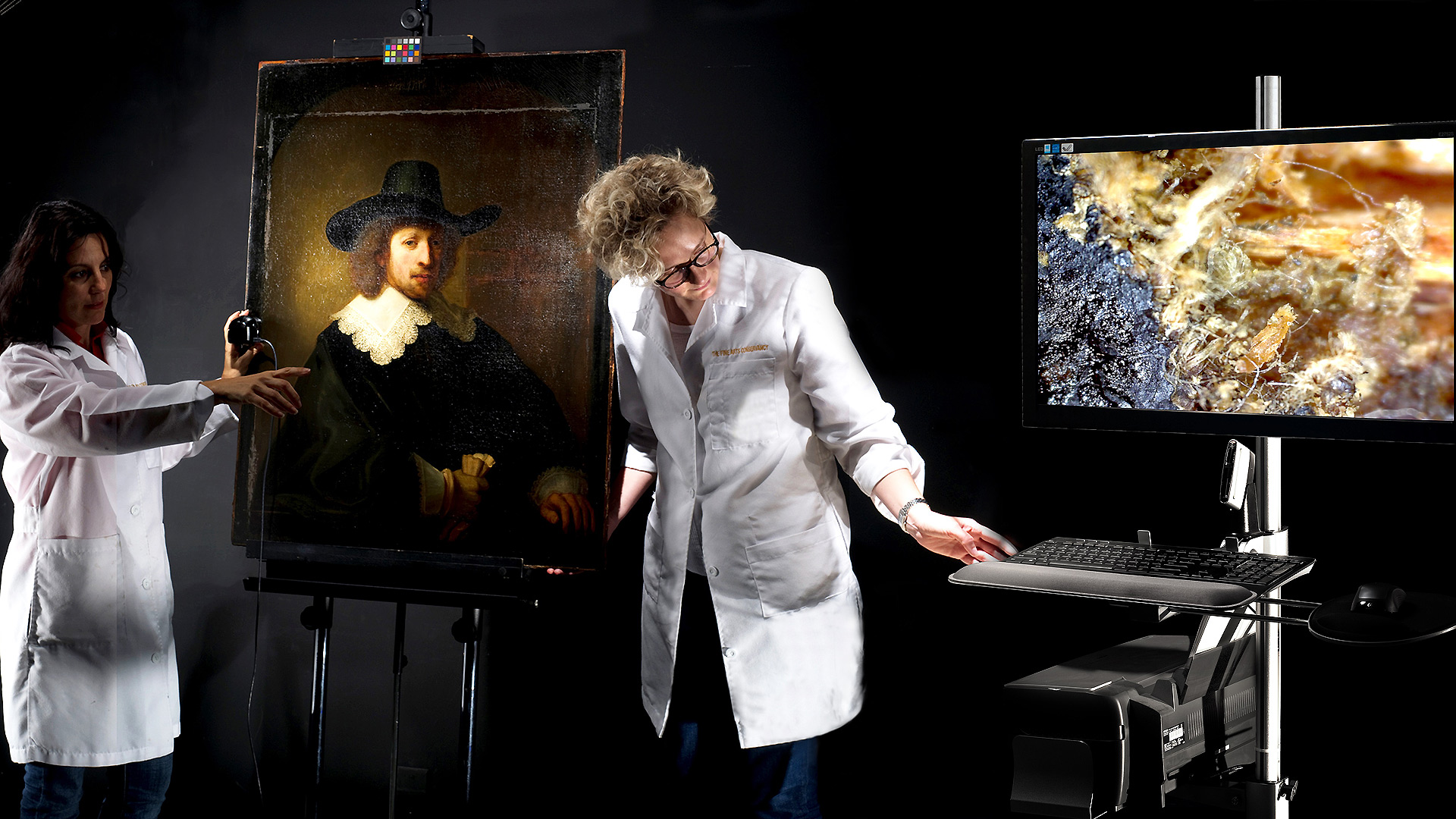 This photograph depicts two women in lab coats conducting scientific analysis of a painting at the Fine Arts Conservatory. The students creating fakes and forgeries will have to propose ways to escape the findings of scientific analysis.
