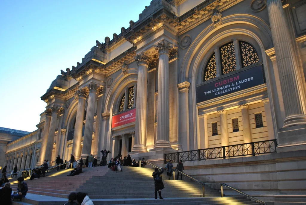 Outdoor image of the Metropolitan Museum of Art, showcasing the entrance during the evening.